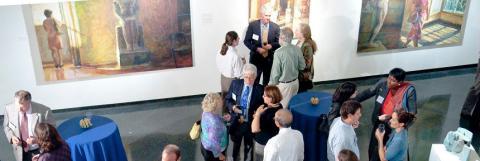 Faculty mingle at art gallery